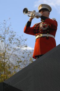 071107-F-6684S-210 A U.S. Marine Corps bugler plays Taps during the Vietnam Veterans Memorial 25th Anniversary Reading of the Names ceremony in Washington, D.C., on Nov. 7, 2007. All names engraved on the wall will be read over a four-day period. DoD photo by Tech. Sgt. Adam M. Stump, U.S. Air Force. (Released)